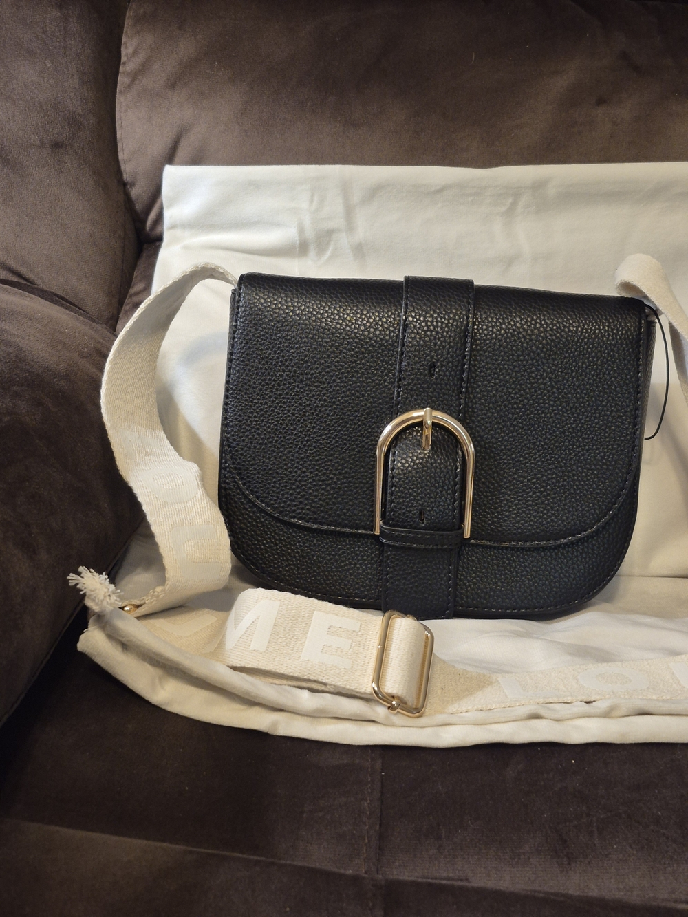 Black Pebbled Crossbody Bag with Gold Buckle and Cream Strap